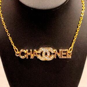 CHANEL CC LOGO 18K GOLD PLATED LOGO PENDANT WITH MULTICOLOR RHINESTONE ACCENTS